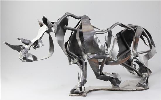 Clare S. Bigger. A modern metal sculpture of a rhino, length 30in.